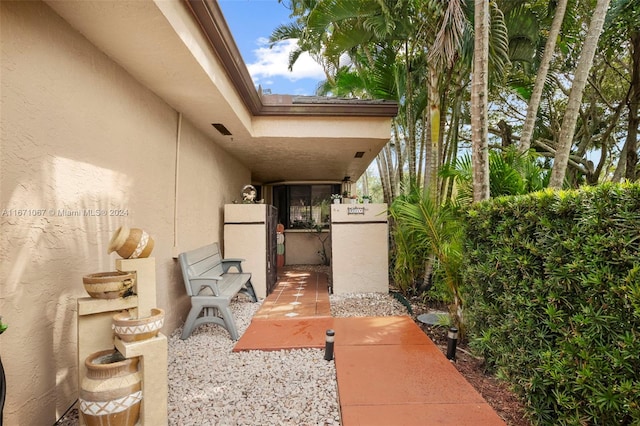 property entrance featuring a patio