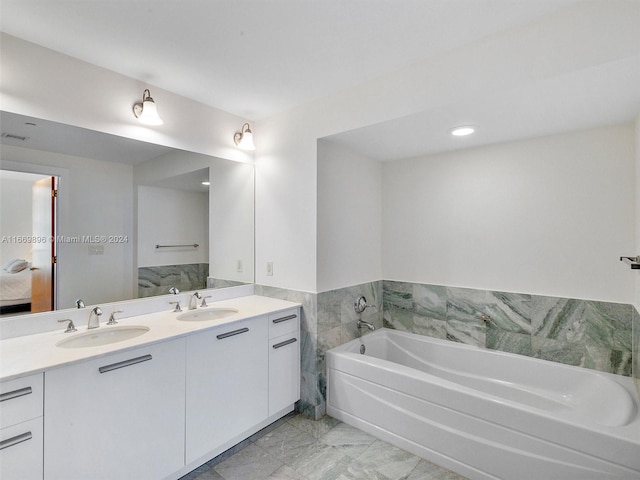 bathroom featuring vanity and a washtub