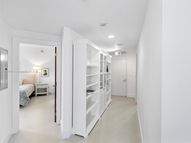 hallway with light tile patterned floors