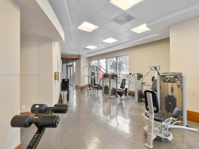 exercise room featuring a paneled ceiling