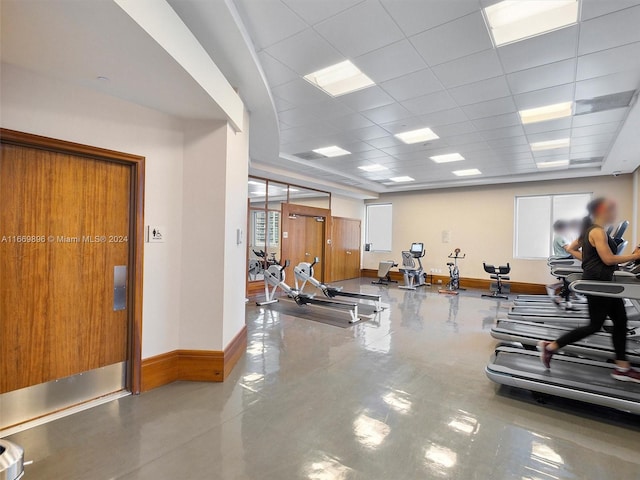 exercise room with a drop ceiling