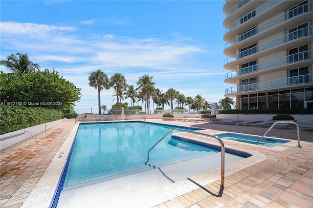 view of swimming pool featuring a patio