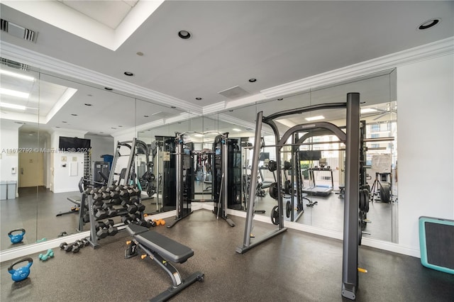 exercise room featuring ornamental molding