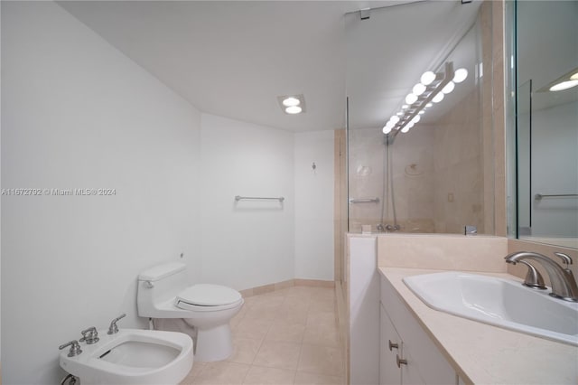 8855 Collins Ave Unit 2D, Surfside, FL 33154 - bathroom featuring a bidet, toilet, vanity, tile patterned flooring, and baseboards