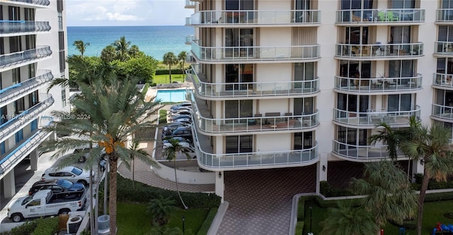 8855 Collins Ave Unit 2D, Surfside, FL 33154 - view of apartment building / complex with a water view and a community pool
