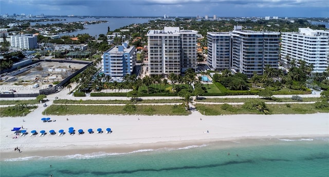 bird's eye view featuring a beach view and a water view