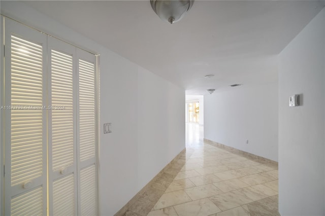 8855 Collins Ave Unit 2D, Surfside, FL 33154 - hallway with light marble finish floors and baseboards