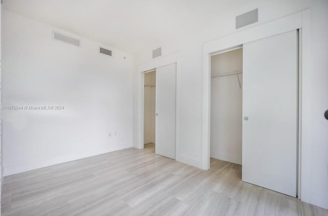 unfurnished bedroom featuring light hardwood / wood-style floors