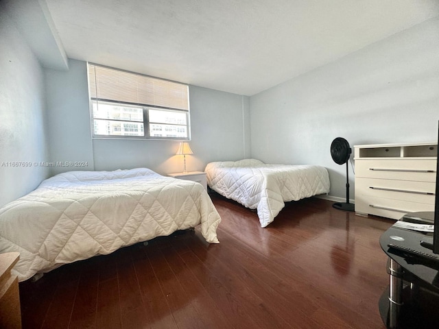 bedroom featuring dark hardwood / wood-style floors