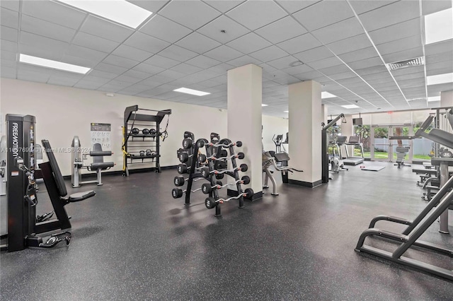 gym featuring a drop ceiling