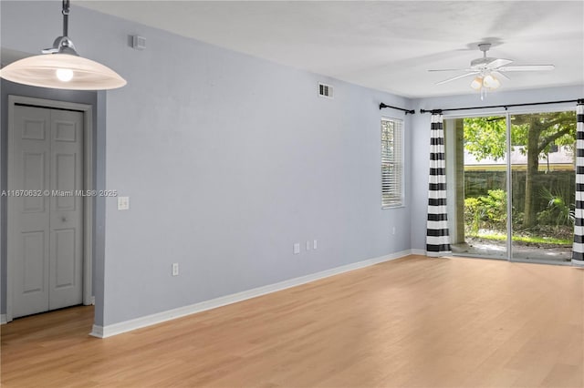 empty room featuring light hardwood / wood-style floors and ceiling fan