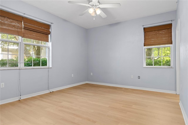 unfurnished room featuring light wood-type flooring and ceiling fan