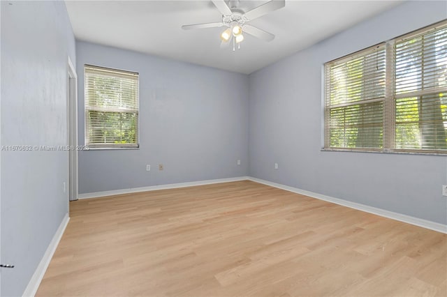 unfurnished room featuring ceiling fan and light hardwood / wood-style floors