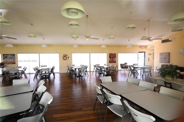 dining area with lofted ceiling, ceiling fan, and dark wood-type flooring