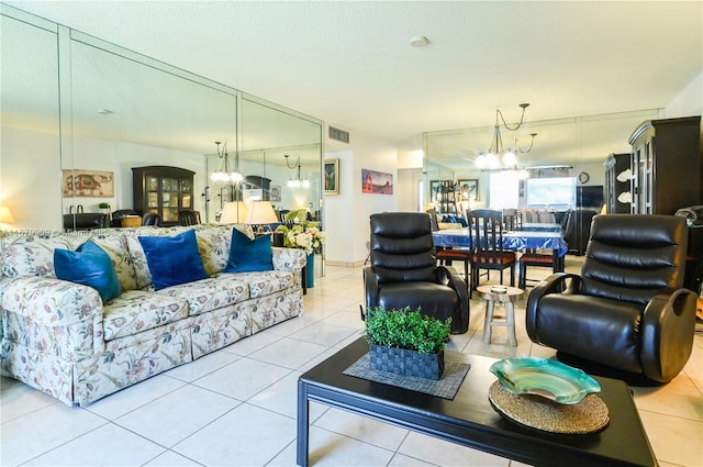 living room featuring a textured ceiling, light tile patterned flooring, and a notable chandelier