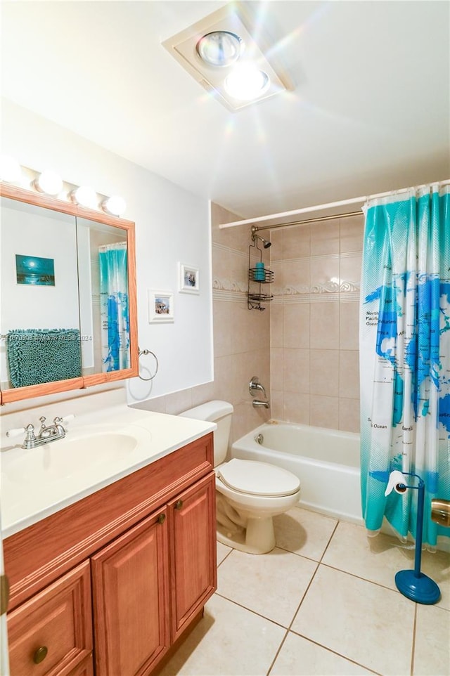 full bathroom with vanity, shower / tub combo with curtain, toilet, and tile patterned floors