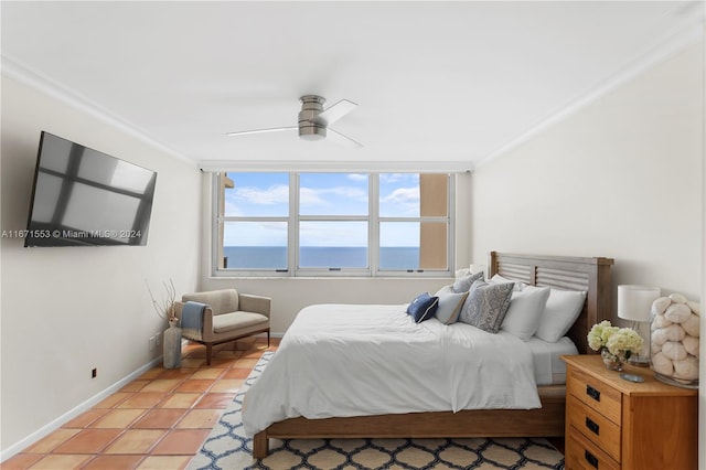 bedroom featuring ceiling fan, crown molding, and light tile patterned floors