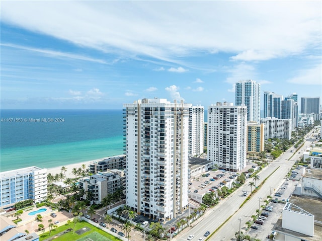 birds eye view of property with a view of the beach and a water view