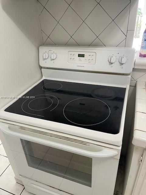 details featuring white range with electric stovetop