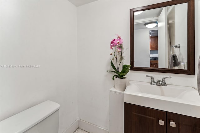 bathroom featuring vanity and toilet