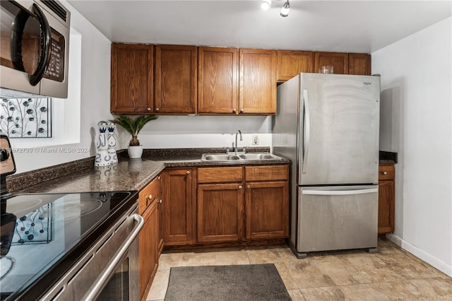 kitchen featuring stainless steel appliances and sink