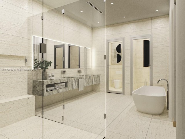 bathroom featuring tile walls, vanity, separate shower and tub, and tile patterned floors