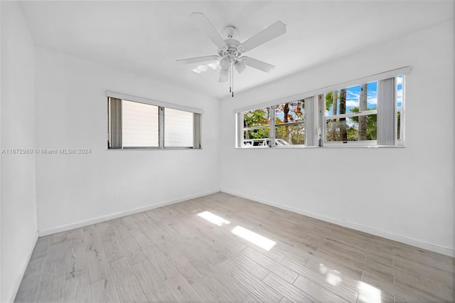 unfurnished room featuring light wood-type flooring and ceiling fan