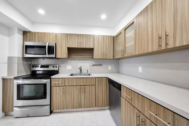 kitchen featuring appliances with stainless steel finishes and sink