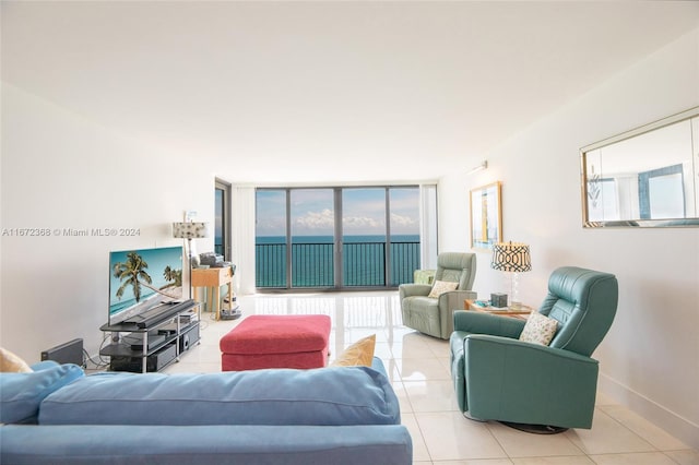 living room with expansive windows and light tile patterned flooring