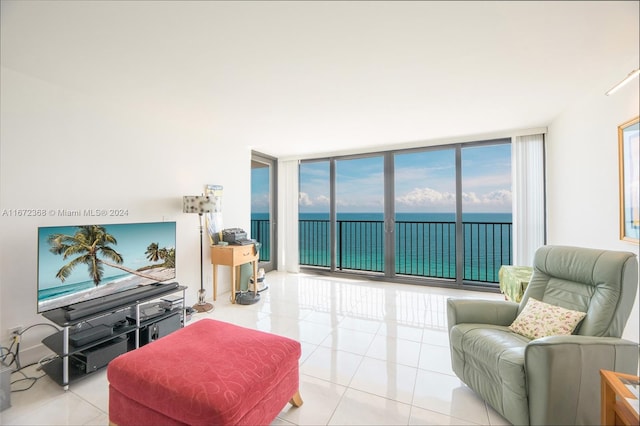 living room featuring light tile patterned floors and expansive windows