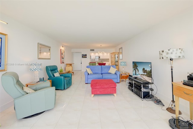 living room with light tile patterned floors