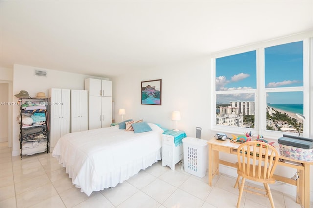 bedroom with light tile patterned floors