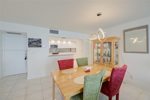 dining area with light tile patterned floors