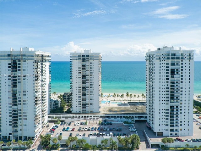 aerial view featuring a view of the beach and a water view