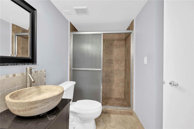 bathroom with walk in shower, tile patterned flooring, vanity, and toilet