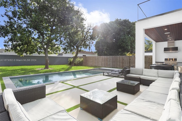 view of pool with an outdoor living space, a grill, and a patio area