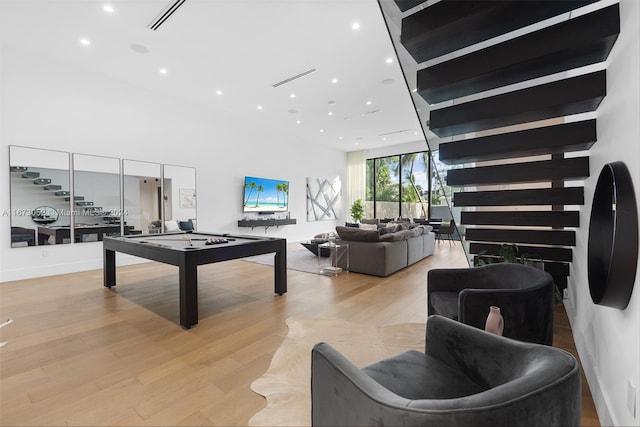 recreation room featuring light hardwood / wood-style flooring