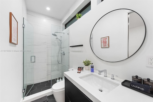 bathroom with walk in shower, vanity, and toilet