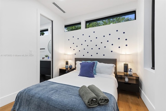 bedroom with light hardwood / wood-style floors