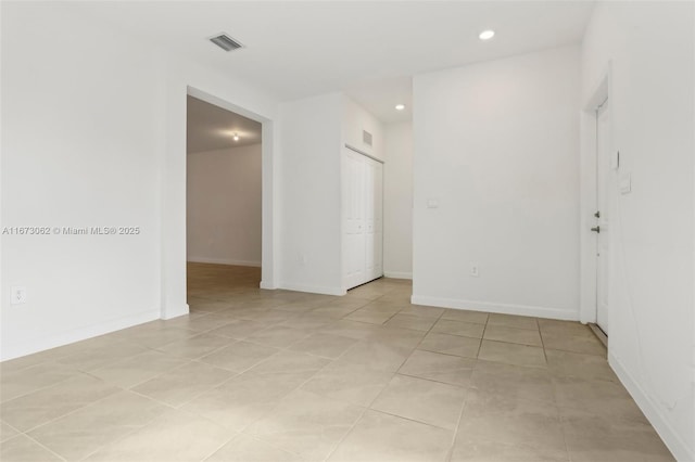 unfurnished room featuring light tile patterned floors