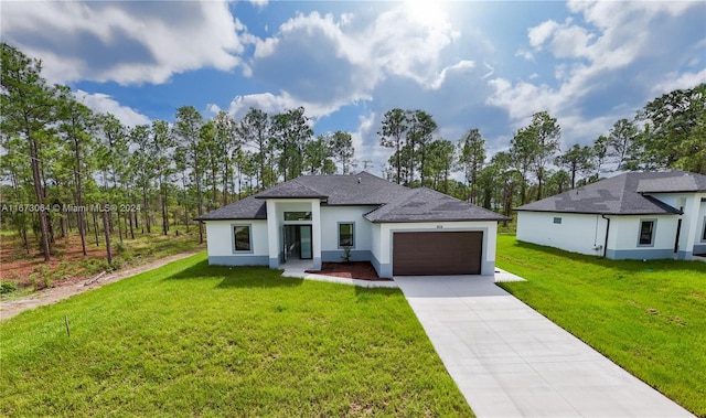 view of front of home featuring a front yard and a garage