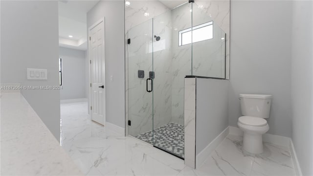 bathroom with toilet and an enclosed shower