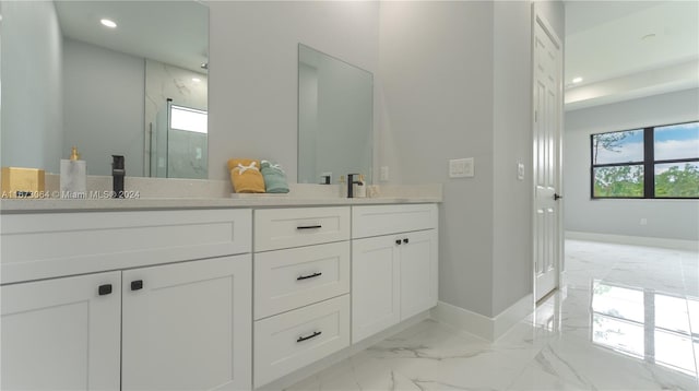 bathroom featuring vanity and a shower with shower door