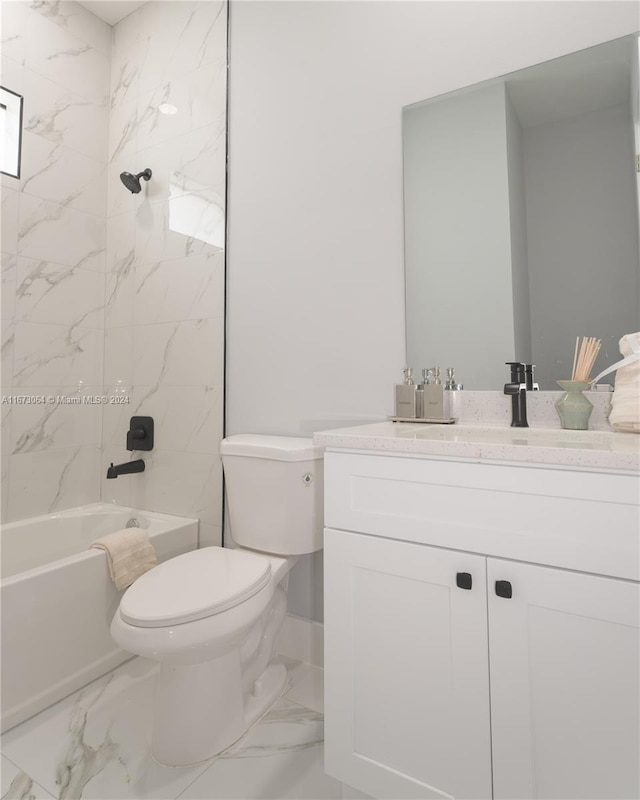 full bathroom with vanity, toilet, and tiled shower / bath combo