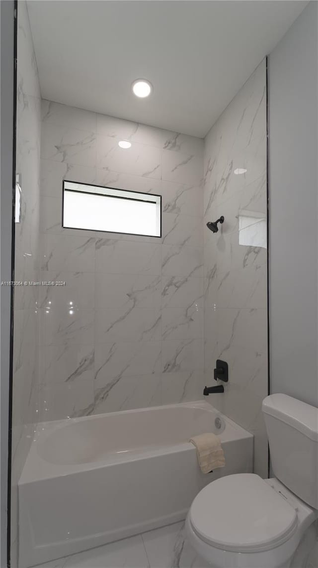 932 Maddock St, Lehigh Acres, FL 33974 - bathroom featuring shower / bathtub combination, marble look tiles, and recessed lighting