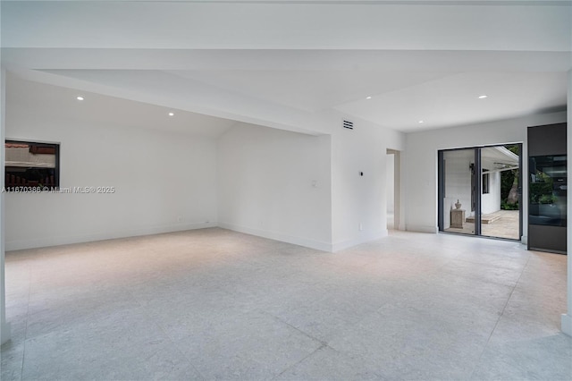 empty room with beamed ceiling