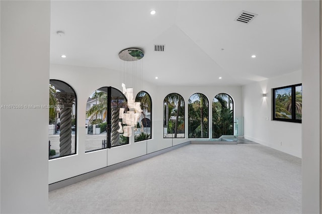 interior space featuring a wealth of natural light and lofted ceiling