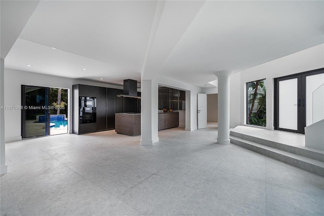 unfurnished living room featuring french doors