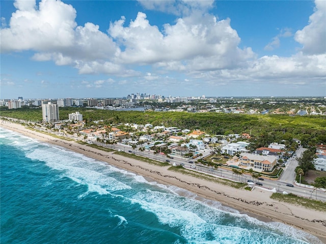 bird's eye view featuring a water view and a view of the beach