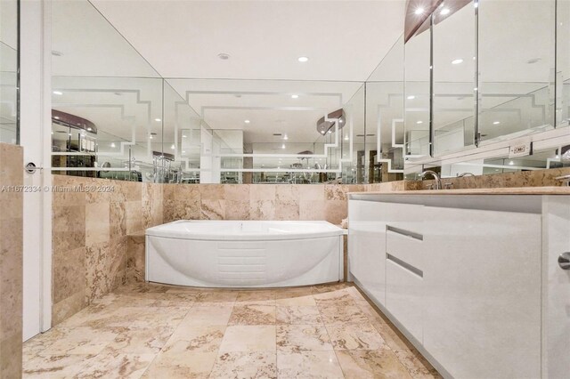 1455 Ocean Dr Unit 1203, Miami Beach, FL 33139 - full bath featuring a garden tub, vanity, and a stall shower